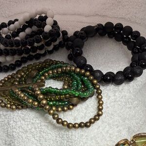 3 fun bracelets. 1 all black on memory wire. 2 stretch cuff styles